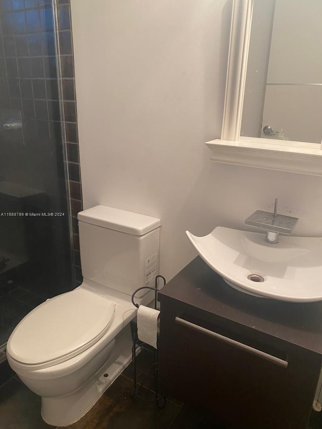 1560 Pennsylvania Ave Unit 213, Miami Beach, FL 33139 - bathroom featuring vanity, tiled shower, and tile patterned floors