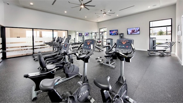 exercise room with a wealth of natural light and ceiling fan