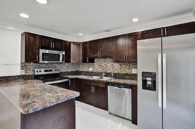 kitchen featuring stainless steel appliances, kitchen peninsula, sink, crown molding, and dark brown cabinets