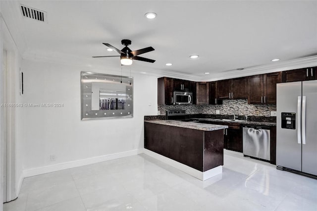 kitchen featuring stainless steel appliances, sink, kitchen peninsula, ceiling fan, and dark brown cabinets