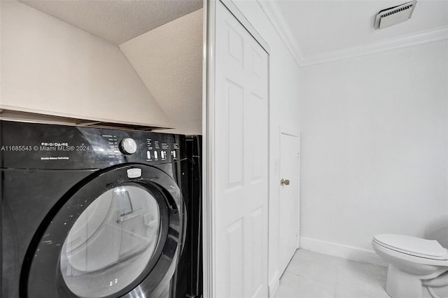 laundry room with ornamental molding, washer / clothes dryer, and a textured ceiling