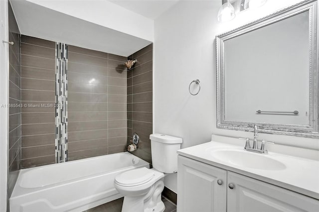 full bathroom with vanity, tiled shower / bath combo, and toilet