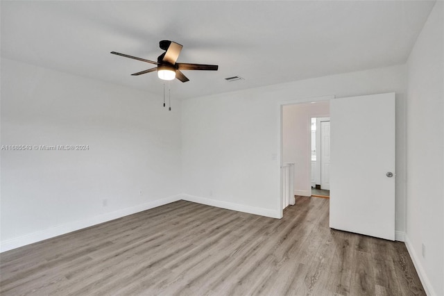 unfurnished room with light hardwood / wood-style flooring and ceiling fan