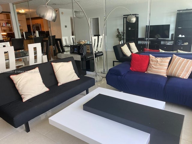 5401 Collins Ave Unit 412, Miami Beach, FL 33140 - living room featuring tile patterned floors and a textured ceiling