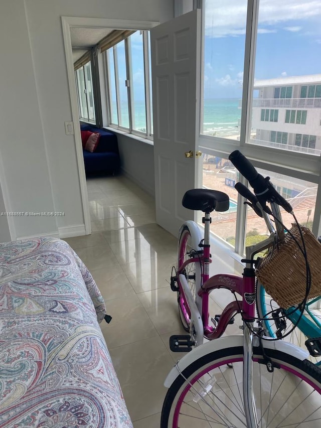 5401 Collins Ave Unit 412, Miami Beach, FL 33140 - bedroom featuring light tile patterned flooring and a water view
