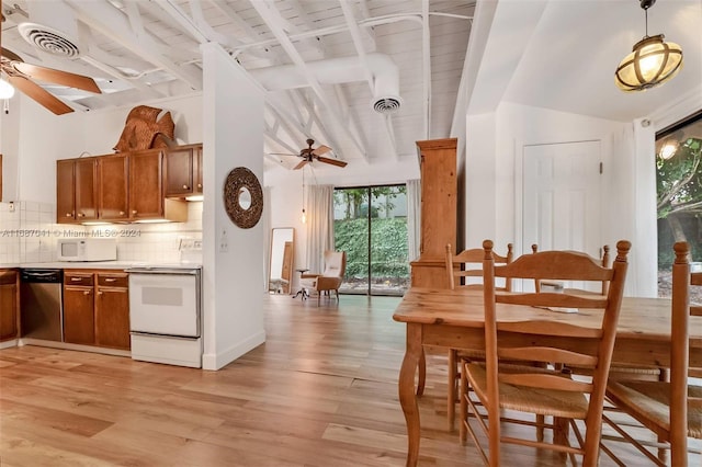 kitchen with decorative backsplash, beam ceiling, light wood-type flooring, white appliances, and decorative light fixtures