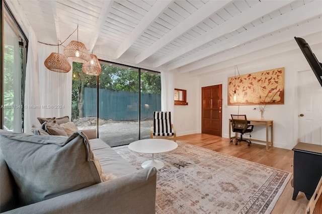 living room featuring wooden ceiling, a wealth of natural light, beam ceiling, and light hardwood / wood-style floors