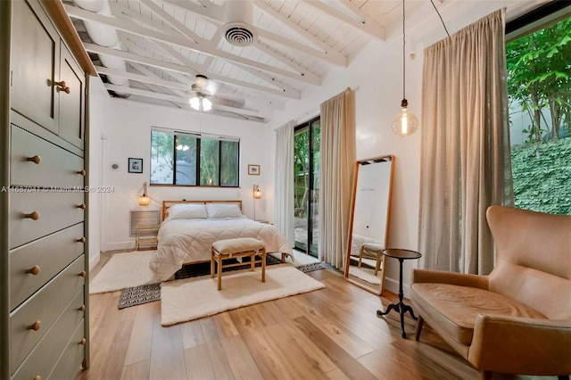 bedroom featuring ceiling fan, light hardwood / wood-style flooring, lofted ceiling with beams, and access to outside