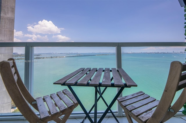 balcony featuring a water view