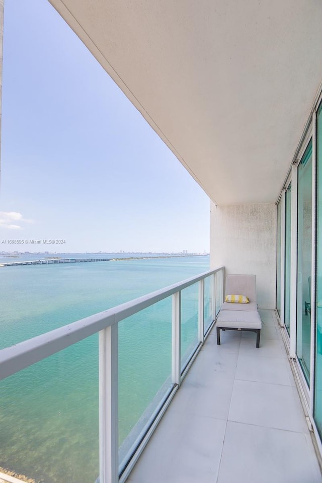 balcony featuring a water view