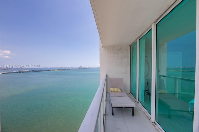 balcony featuring a water view