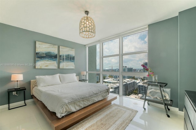 bedroom featuring a wall of windows