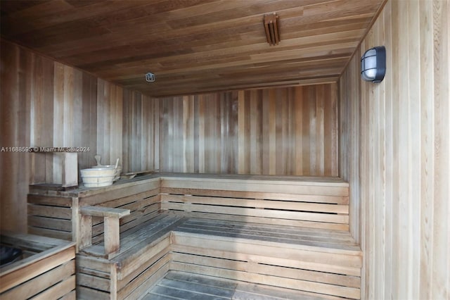 view of sauna / steam room with wood walls and wood ceiling