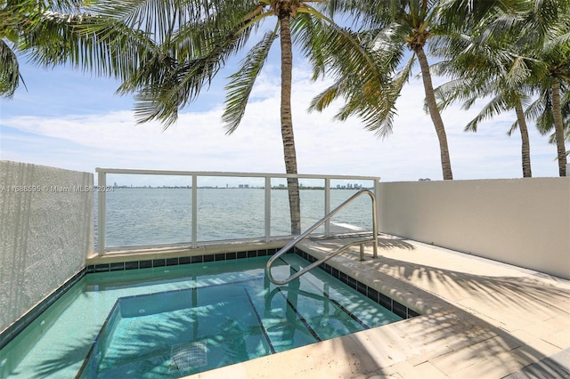 view of pool with a water view