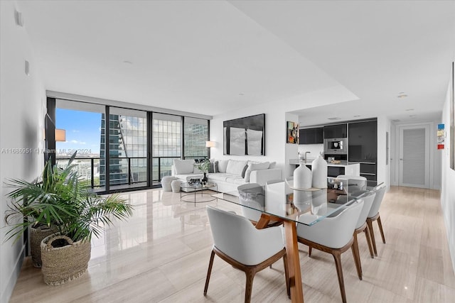 dining room with a wall of windows