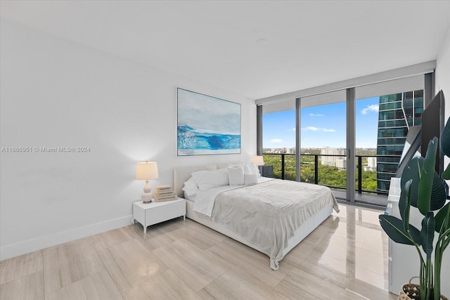 1451 Brickell Ave Unit 2205, Miami, FL 33131 - bedroom featuring expansive windows and access to outside