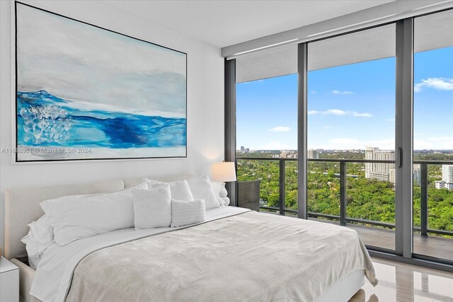 1451 Brickell Ave Unit 2205, Miami, FL 33131 - bedroom featuring floor to ceiling windows and access to exterior
