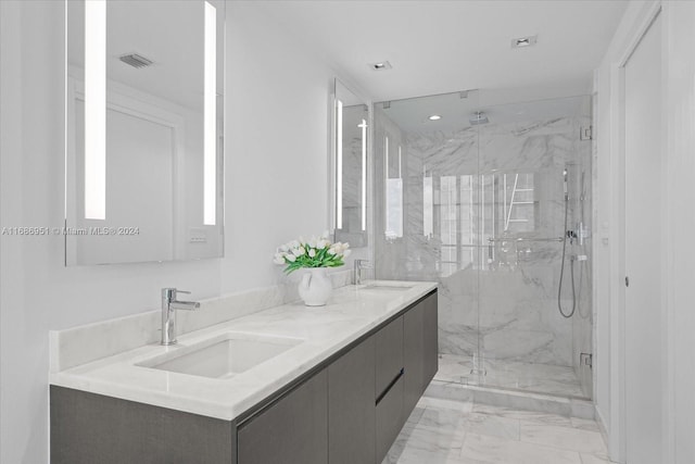 1451 Brickell Ave Unit 2205, Miami, FL 33131 - bathroom featuring marble finish flooring, a marble finish shower, double vanity, and recessed lighting