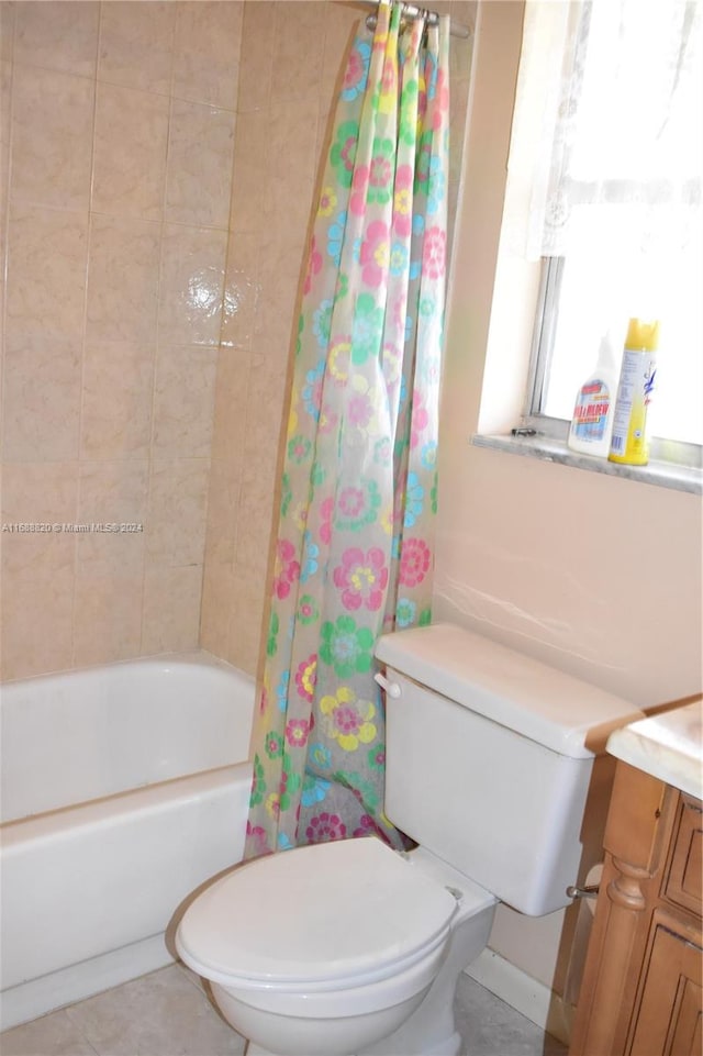 full bathroom with tile patterned floors, vanity, toilet, and shower / tub combo with curtain