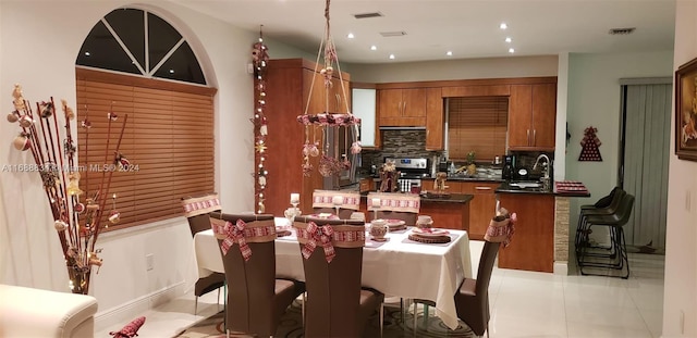 dining room featuring light tile patterned floors and sink