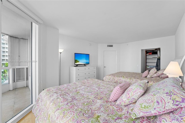 bedroom with light wood-type flooring