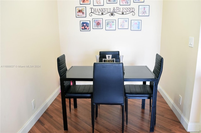 dining area with hardwood / wood-style flooring