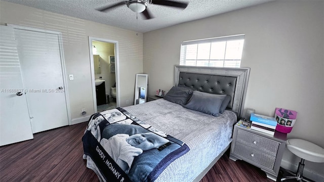 bedroom with ensuite bathroom, ceiling fan, a textured ceiling, and dark hardwood / wood-style flooring