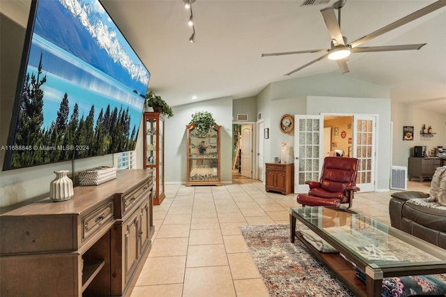 tiled living room with vaulted ceiling and ceiling fan