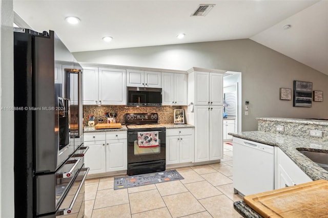 kitchen featuring white dishwasher, white cabinetry, black electric range oven, and vaulted ceiling