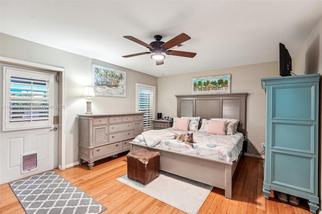 bedroom featuring light hardwood / wood-style flooring and ceiling fan