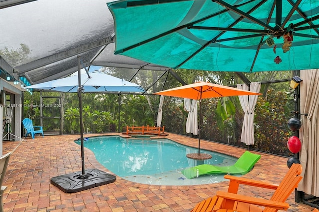 view of swimming pool featuring glass enclosure, a patio, and an in ground hot tub