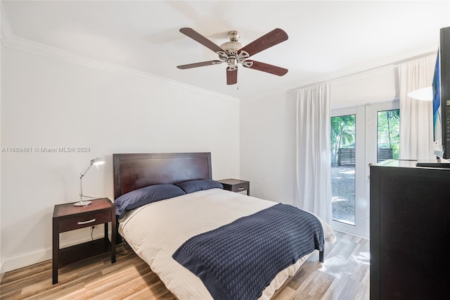 bedroom with access to exterior, light wood-type flooring, ceiling fan, and ornamental molding