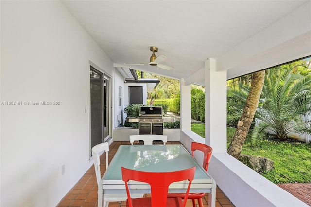 view of patio with a grill, ceiling fan, and exterior kitchen