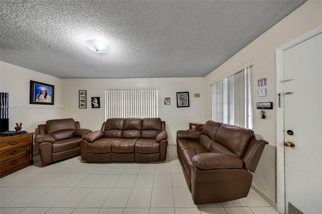 tiled living room with a textured ceiling