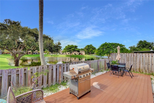 deck featuring grilling area and a water view