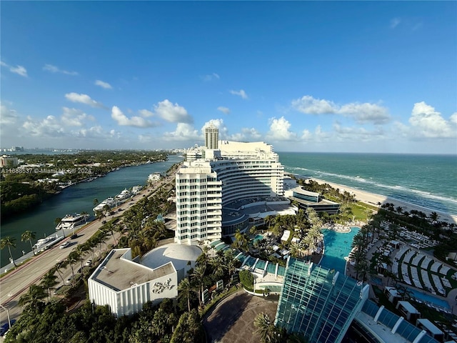 birds eye view of property featuring a beach view and a water view