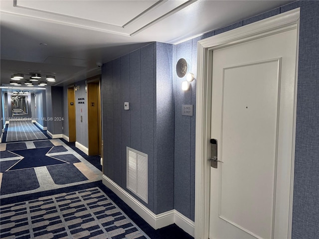 corridor with dark carpet