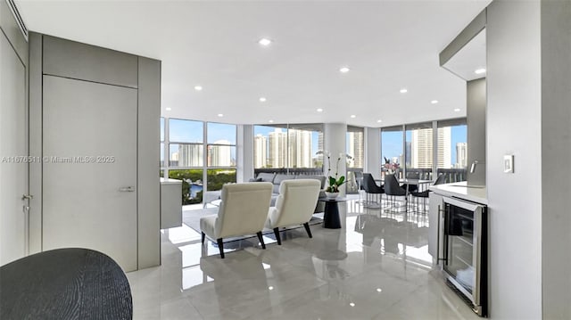 empty room with expansive windows and tile patterned floors