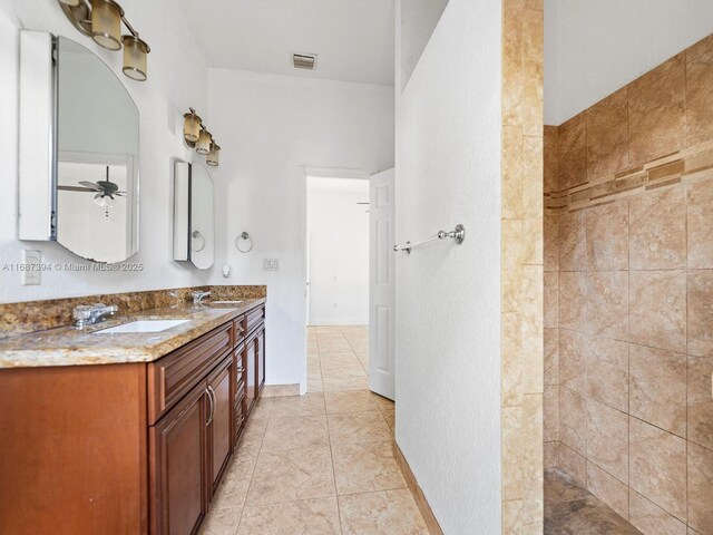 kitchen with stainless steel appliances, a kitchen bar, decorative backsplash, sink, and kitchen peninsula