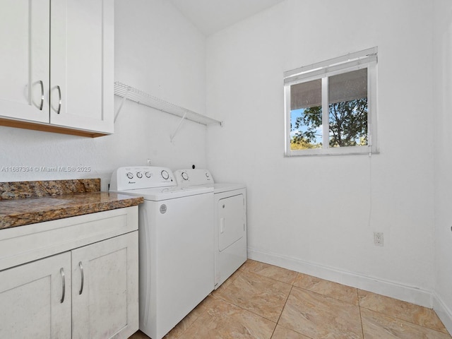 washroom with cabinets and independent washer and dryer