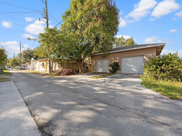 view of front of property featuring an outbuilding and a garage