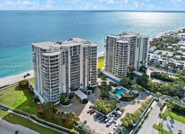 bird's eye view featuring a water view and a view of the beach