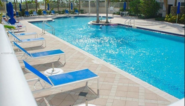 view of pool featuring a patio