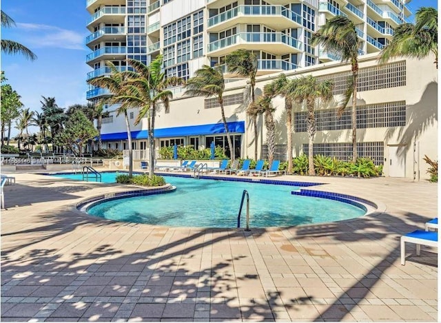 view of swimming pool with a patio area