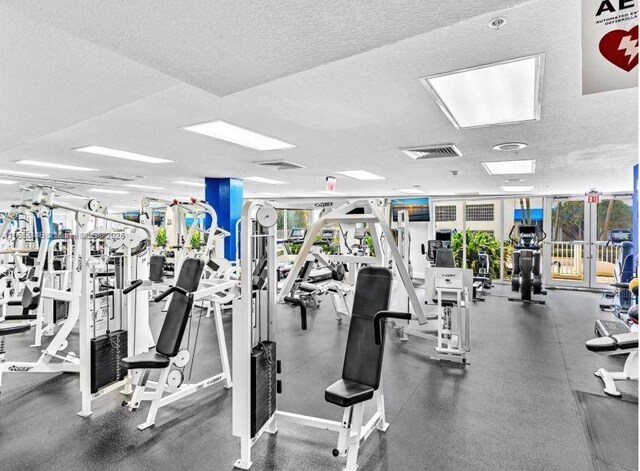 gym with a textured ceiling