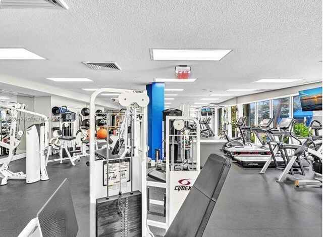 workout area featuring a textured ceiling