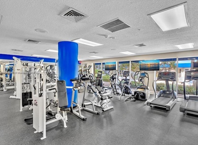 exercise room with a textured ceiling