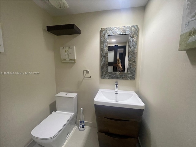 bathroom with vanity and toilet