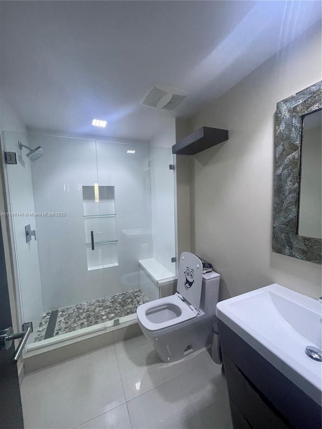 bathroom featuring walk in shower, tile patterned floors, vanity, and toilet