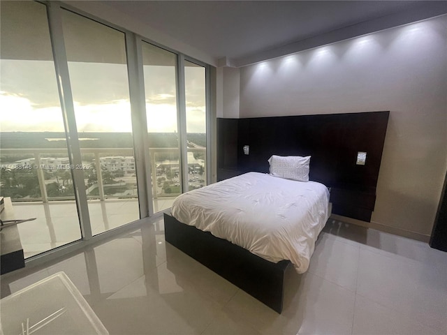 tiled bedroom with expansive windows